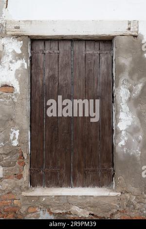 Old wooden window and brick wall. Antique window Stock Photo