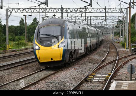 Avanti West Coast Pendolino 390134 speeds through Rugeley Trent Valley with the 09:43 Liverpool Lime Street to London Euston on 28 June 2023 Stock Photo