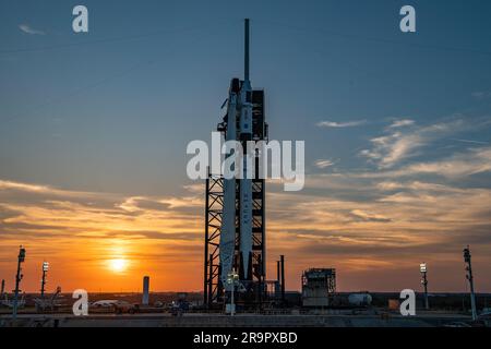 SpaceX Crew-6 Sunset at LC-39A. A colorful sunset serves as the backdrop for SpaceX’s Falcon 9 rocket and Dragon spacecraft Endeavour on the pad at Launch Complex 39A at Kennedy Space Center in Florida on Feb. 23, 2023, for NASA’s SpaceX Crew-6 mission. NASA astronauts Stephen Bowen, spacecraft commander, and Warren “Woody” Hoburg, pilot, along with mission specialists Sultan Alneyadi, UAE (United Arab Emirates) astronaut, and Andrei Fedyaev, Roscosmos cosmonaut, are slated to launch to the International Space Station at 1:45 a.m. EST on Feb. 27 from Launch Complex 39A. Crew-6 is the sixth cre Stock Photo