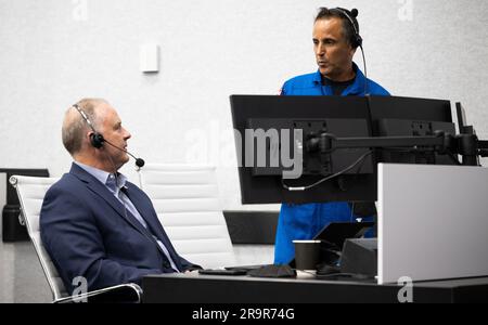 NASA’s SpaceX Crew-6 Launch. Norm Knight, director of Flight Operations at NASA's Johnson Space Center, left, and Joe Acaba, Chief of the Astronaut Office, right are seen as they monitor the countdown of the launch of a SpaceX Falcon 9 rocket carrying the company's Dragon spacecraft on NASA’s SpaceX Crew-6 mission with NASA astronauts Stephen Bowen and Warren 'Woody' Hoburg, UAE (United Arab Emirates) astronaut Sultan Alneyadi, and Roscosmos cosmonaut Andrey Fedyaev onboard, Wednesday, March 1, 2023, in firing room four of the Rocco A. Petrone Launch Control Center at NASA’s Kennedy Space Cent Stock Photo