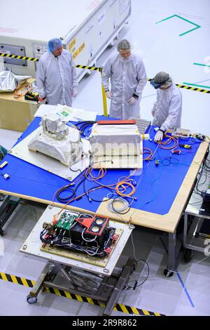 OpComm Delivery For Orion Artemis II. Inside the high bay of the Neil Armstrong Operations and Checkout Building at NASA’s Kennedy Space Center in Florida, technicians assemble on the Optical Communications System for the Artemis II mission on June 2, 2023. Optical communications is the latest space communications technology that is able to provide data rates as much as a hundred times higher than current systems. This will allow astronauts to send and receive ultra-high-definition video from the surface of the Moon or other planets such as Mars. Artemis II will be the first Artemis mission fl Stock Photo