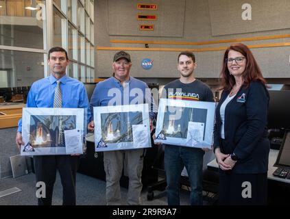 Artemis I Launch Director and Plaque Award Ceremony. Artemis Launch Director Charlie Blackwell-Thompson (right) acknowledged and honored members of the Artemis team during the inaugural Artemis Launch Director Awards, held March 23, 2023, inside Firing Room 1 of the Rocco A. Petrone Launch Control Center at NASA’s Kennedy Space Center in Florida. Award recipients included members of the red crew, who are employees of ERC – a company that partners with Jacobs, which is the prime contractor on NASA’s Test and Operations Support Contract. From left are ERC employees Chad Garrett, safety engineer; Stock Photo