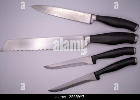 Essential Tools: A Set of Sleek Kitchen Knives for Culinary Mastery Stock Photo