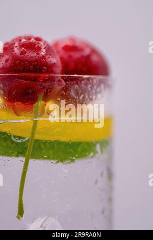 Up Close and Flavorful: Macro Perspective of Mouthwatering Fruit Garnishes on a Scrumptious Drink Stock Photo