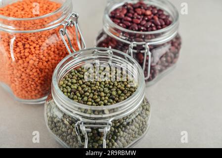 Mung beans, beans, red lentils  in glass jars. Zero waste storage concept. Stock Photo