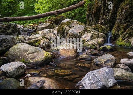 The Pwll y Berw River near The Sychryd Cascades or Sgydau Sychryd Falls in Waterfall Country near the Dinas Rock, Pontneddfechan, Brecon Beacons National Park, South Wales, UK. Long exposure water. Stock Photo