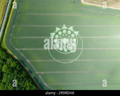 A crop circle, crop formation, or corn circle is a pattern created by flattening a crop.  Owslebury, Hampshire. Stock Photo