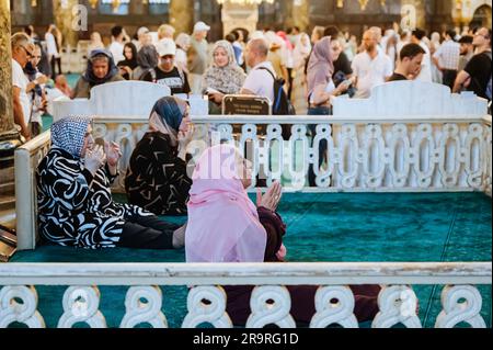 Istanbul, Turkey. 28th June, 2023. A Muslim woman seen praying inside the mosque. During the first day of the Muslim Feast of Sacrifice (Eid al-Adha or Kurban Bayrami in Turkish), foreign and local tourists visit the ancient Byzantine church of Hagia Sofia (Ayasofya in Turkish, Saint Sophia, in English), re-converted in the Great Mosque of Ayasofya in 2020, after being turned into a public museum in 1935. Credit: SOPA Images Limited/Alamy Live News Stock Photo