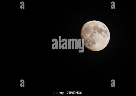 Full moon against a black sky Stock Photo
