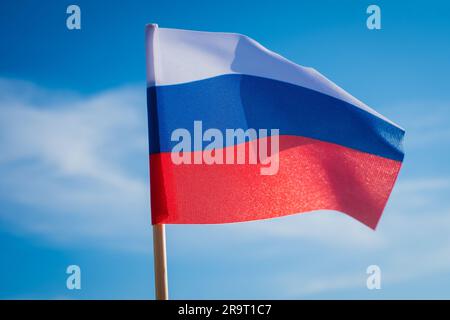 Flag of Russia on blue sky background. Stock Photo