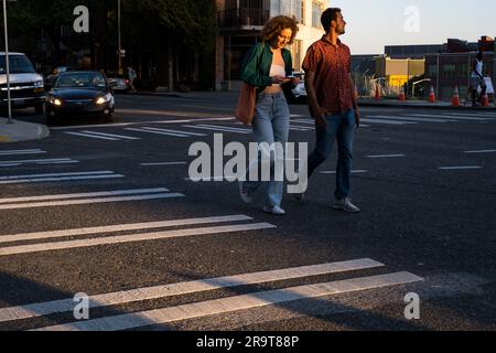 Seattle, USA. 18th May, 2023. Pedestrians crossing in Belltown on 1st. Stock Photo