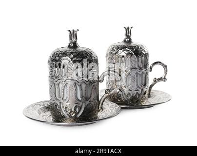 Beautiful vintage cup holders and saucers on white background Stock Photo