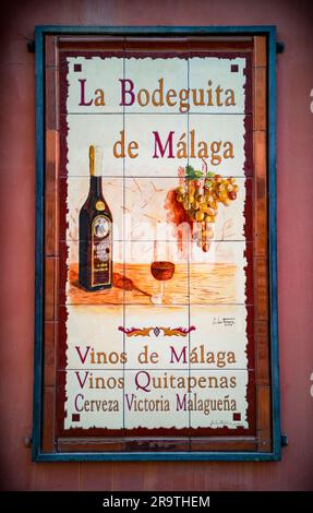 Traditional tile street sign advertising wine and bar in Malaga City, Andalucia, Spain Stock Photo