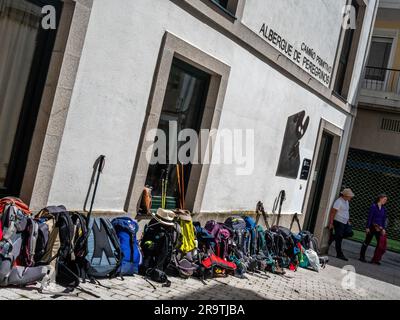 May 29, 2023, Lugo, Spain: A lot of backpacks are seen placed in line outside of the albergue (hostel). The Camino de Santiago (the Way of St. James) is a large network of ancient pilgrim routes stretching across Europe and coming together at the tomb of St. James (Santiago in Spanish) in Santiago de Compostela in northwest Spain. The Camino Primitivo is the original and oldest pilgrimage route. It links Oviedo with Santiago de Compostela. It's characterized as being one of the hard routes but also for being one of the most attractive Jacobean routes. In 2015, it was listed as a World Heritage Stock Photo