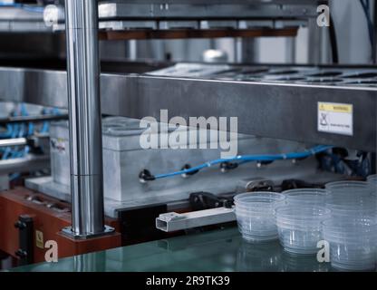 Plastic bowls finish product from plastic injection molding machine. Stock Photo