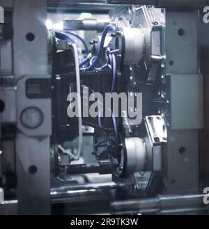 Close up plastic injection molding machine. Stock Photo
