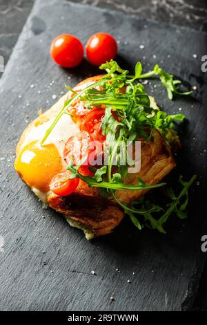 Homemade savoury breakfast Danish with a free-range egg, cherry ...