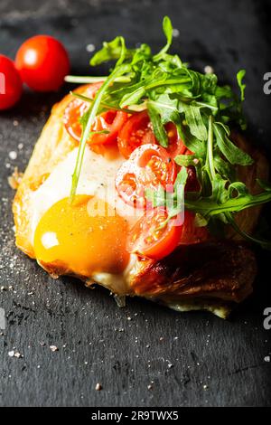 Homemade savoury breakfast Danish with a free-range egg, cherry ...
