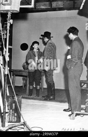 BARBARA STANWYCK and JOEL McCREA on set candid costume test during filming of UNION PACIFIC 1939 director CECIL B. DeMILLE novel / story Ernest Haycox Paramount Pictures Stock Photo