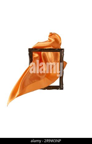 Golden satin cloth flying thru a wooden frame, motion blur unveiling product, abstract backdrop. Stock Photo