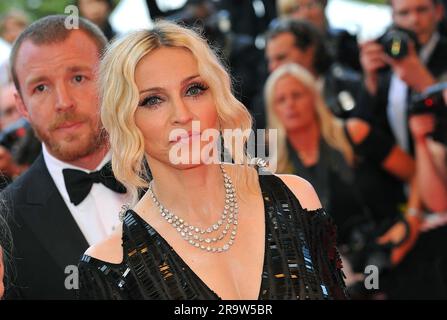 Cannes, France. 29th June, 2023. File photo dated May 21, 2008 of Guy Ritchie and Madonna seen arriving at the Palais des Festivals in Cannes, Southern France, for the screening of Steven Soderbergh's Che presented in competition at the 61st Cannes Film Festival. Madonna's upcoming Celebration tour has been postponed after the singer was hospitalized with a “serious bacterial infection”, according to an Instagram post from her longtime manager Guy Oseary. The tour was scheduled to kick off in Vancouver on 15 July. Photo by Hahn-Nebinger-Orban/ABACAPRESS.COM Credit: Abaca Press/Alamy Live News Stock Photo