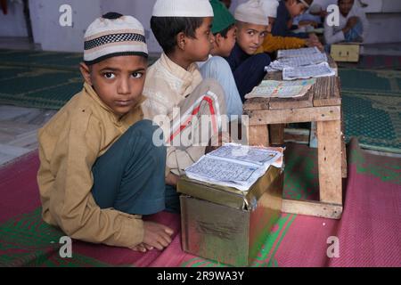 Students pray in a islamic school in Delhi, India Stock Photo