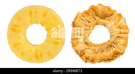 Pineapple rings on a white isolated background. Concept or process of fruit drying. Rings of ripe and dried pineapple as a method of processing and Stock Photo
