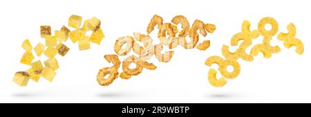 Pineapple slices on a white isolated background. A large set of pineapple slices of different cuts. Dried and ripe pieces of pineapple fall and Stock Photo
