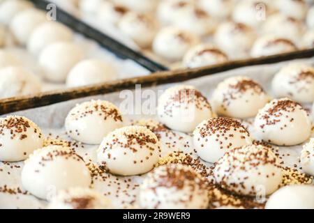 unbaked buns production of traditional sicilian food in an industrial bakery. Stock Photo