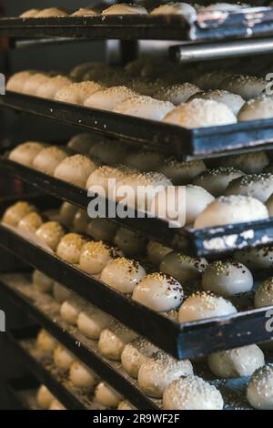 unbaked buns production of traditional sicilian food in an industrial bakery. Stock Photo