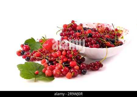 various berries in a plate isolated on white, top view, leaves Stock Photo