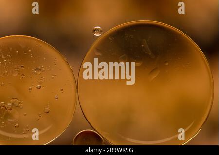 Abstract colorful bubbles. Soft background with gold and copper color circles. Stock Photo