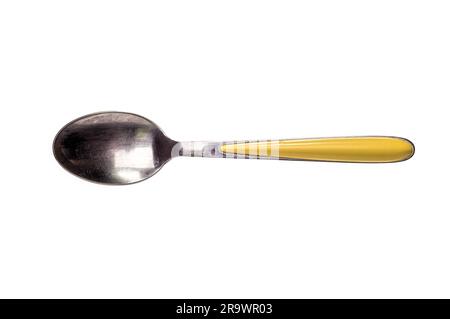 A metallic stainless inox tea spoon with yellow handle isolated on white background Stock Photo