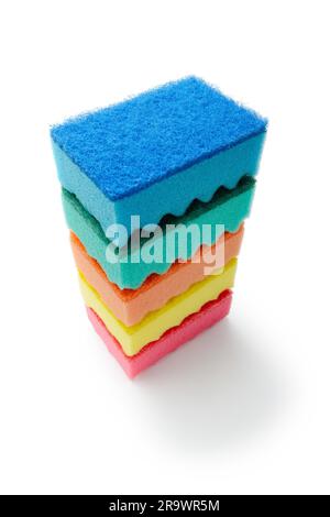 A stack of multicolored kitchen sponges isolated on white background Stock Photo