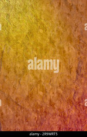 A colored crumpled orange paper texture for background use Stock Photo