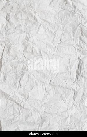 A crumpled whit paper texture for background use Stock Photo