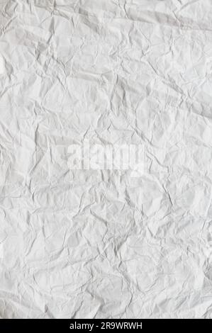 A crumpled whit paper texture for background use Stock Photo