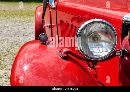 Red MG convertible, English classic car, detail with headlight, Hoexter, Germany Stock Photo