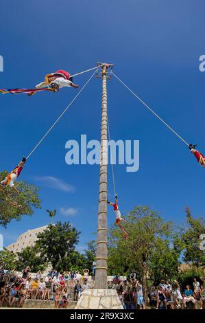 Papantla Flying Men, hanging upside down in the air, Xcaret Eco Park, near Playa del Carmen, Riviera Maya, Quintana Roo, Yucatan, Mexico, Yucatan Stock Photo