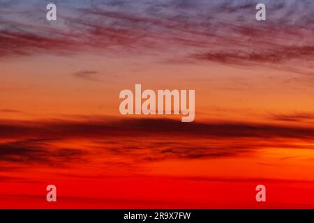 Sunset red evening sky. Warm, saturated colors. Background abstract image Stock Photo