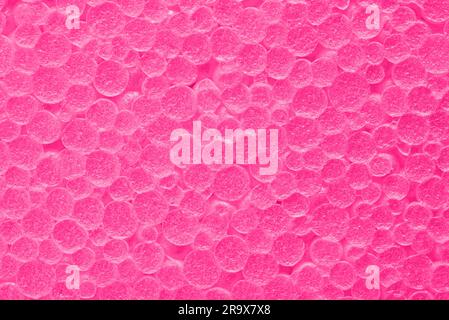Texture of pink foam plastic. Pink bubbles textured background. Stock Photo