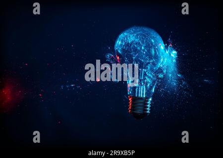 broken bulb with impact on black background, high-speed photography Stock Photo