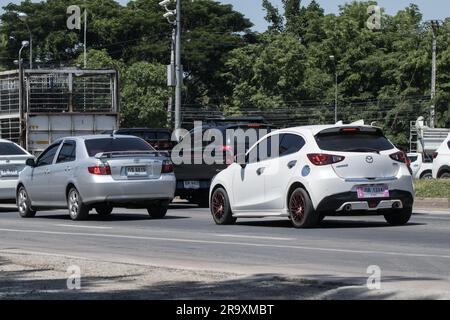 Chiangmai, Thailand -   June  1 2023: Private Eco car Mazda 2. On road no.1001 8 km from Chiangmai Business Area. Stock Photo