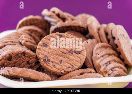 Chocolate Chip Cookies Or Biscuits. Isolated On Magenta Background. Selective Focus. Copy Space On Top Side Stock Photo