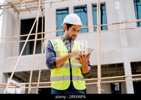 Portrait of cvil engineer with safety uniform working at construction site outdoor, Construction worker checking and controlling project on building Stock Photo
