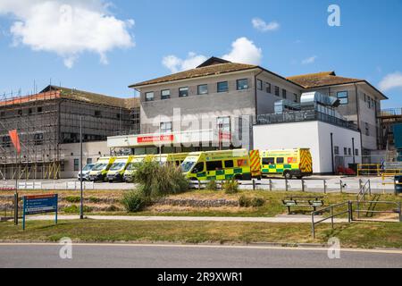 Truro, UK. 29th June, 2023. Ambulances wait outside A & E at The Royal Cornwall Hospital in Treliske, Truro on a sunny Day. Patients are having to wait their turn which can be many hours to be taken in to A&E to be seen. Credit: Keith Larby/Alamy Live News Stock Photo