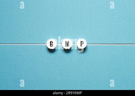 GMP - word concept on building blocks, text Stock Photo
