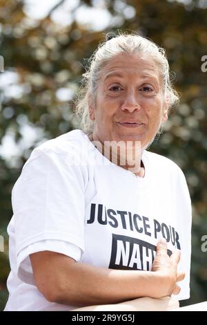 Mounia Merzouk, the mother of Nahel, a teenage driver shot dead by a policeman, during a commemoration march (marche blanche) for her son, in the Pablo Picasso area of the Parisian suburb of Nanterre, on June 29, 2023. Violent protests broke out in France in the early hours of June 29, 2023, as anger grows over the police killing of a teenager, with security forces arresting 150 people in the chaos that saw balaclava-clad protesters burning cars and setting off fireworks. Nahel M., 17, was shot in the chest at point-blank range in Nanterre in the morning of June 27, 2023, in an incident that h Stock Photo
