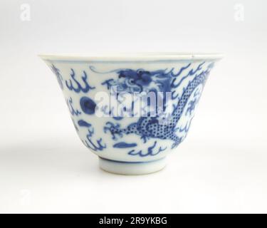 Antique Chinese blue and white dragon porcelain tea bowl. Stock Photo