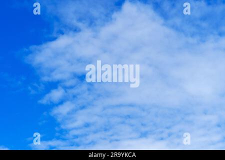 Beautiful cirrus clouds on a blue summer sky Stock Photo